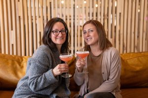 Goods and co sidebar header - two women drinking cocktails at Woodside